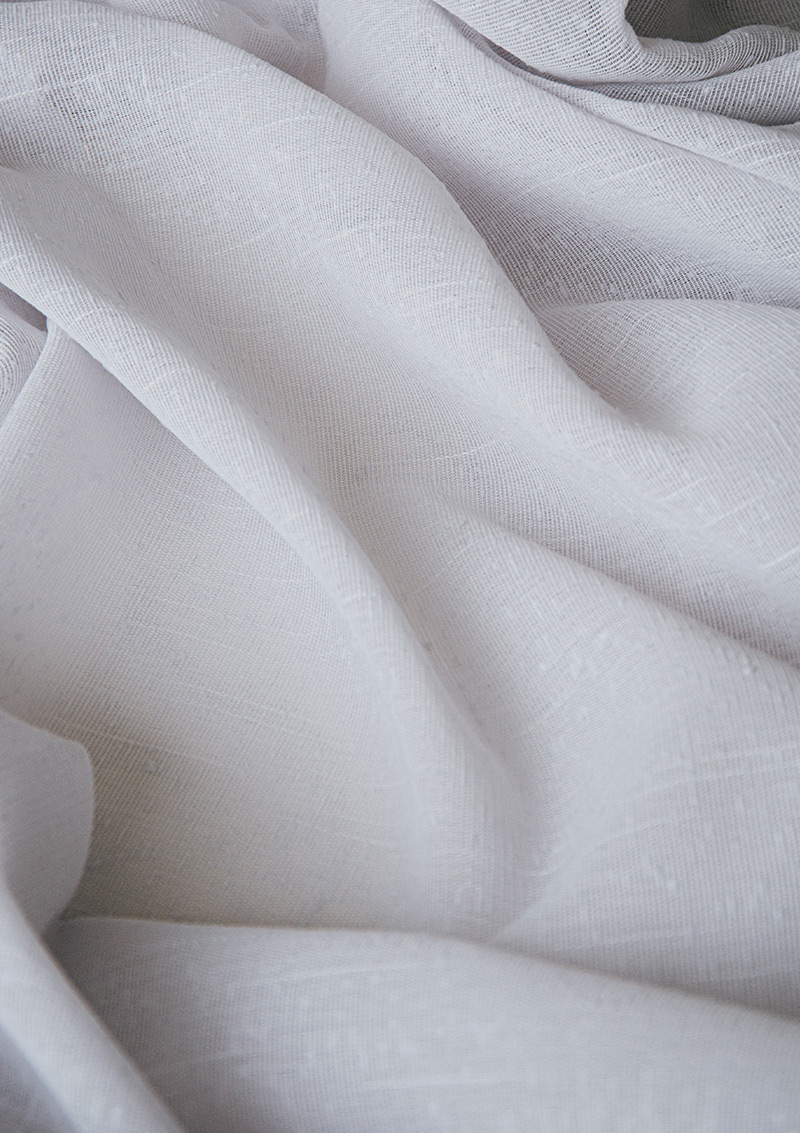 Close-up of BORN Pearl curtain bouclé fabric showing its weave