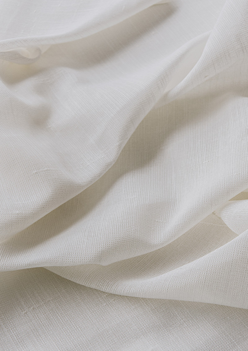 Close-up of NATALI White curtain fabric showing its linen-polyester weave.