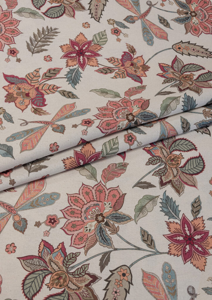 Fabric close-up of CAMELIA with dragonflies and oversized blooms.