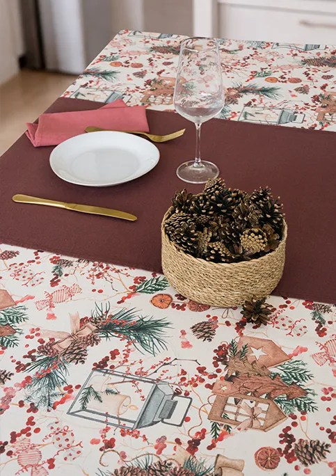 GUBBIO FABRIC, from GRENAT Collection. A mix of seasonal objects like pinecones, candles, lanterns, and sweets arranged in a dense, all-over layout. It feels detailed and layered, with a strong festive character.