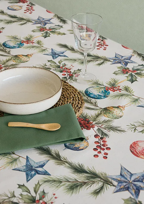 OBIDOS FABRIC, from GRENAT Collection. Pine branches decorated with Christmas ornaments and berries. The composition is open, allowing each element to stand out clearly against the background.