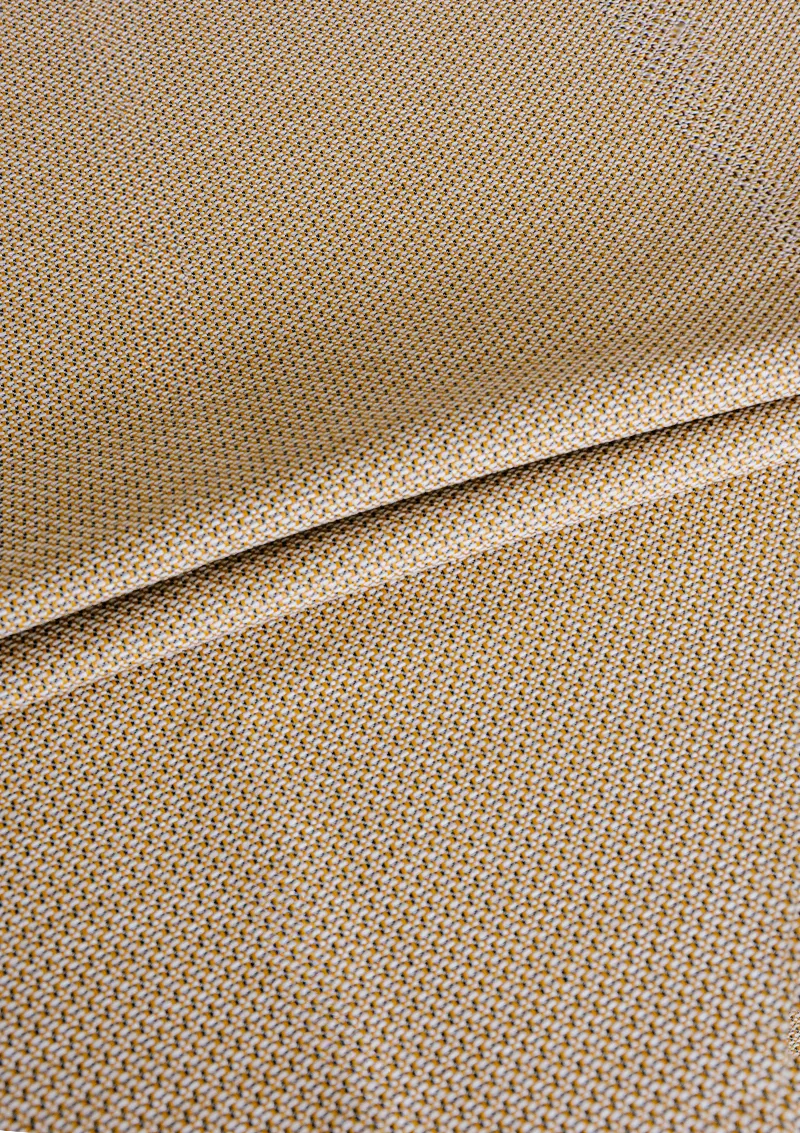 Zoomed-in view of Azuria outdoor fabric highlighting fine texture, color depth, and water-repellent surface. Sesam color