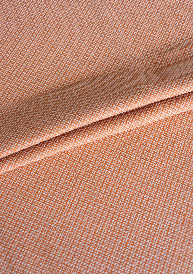 Zoomed-in view of Azuria outdoor fabric highlighting fine texture, color depth, and water-repellent surface. Orange color fabric