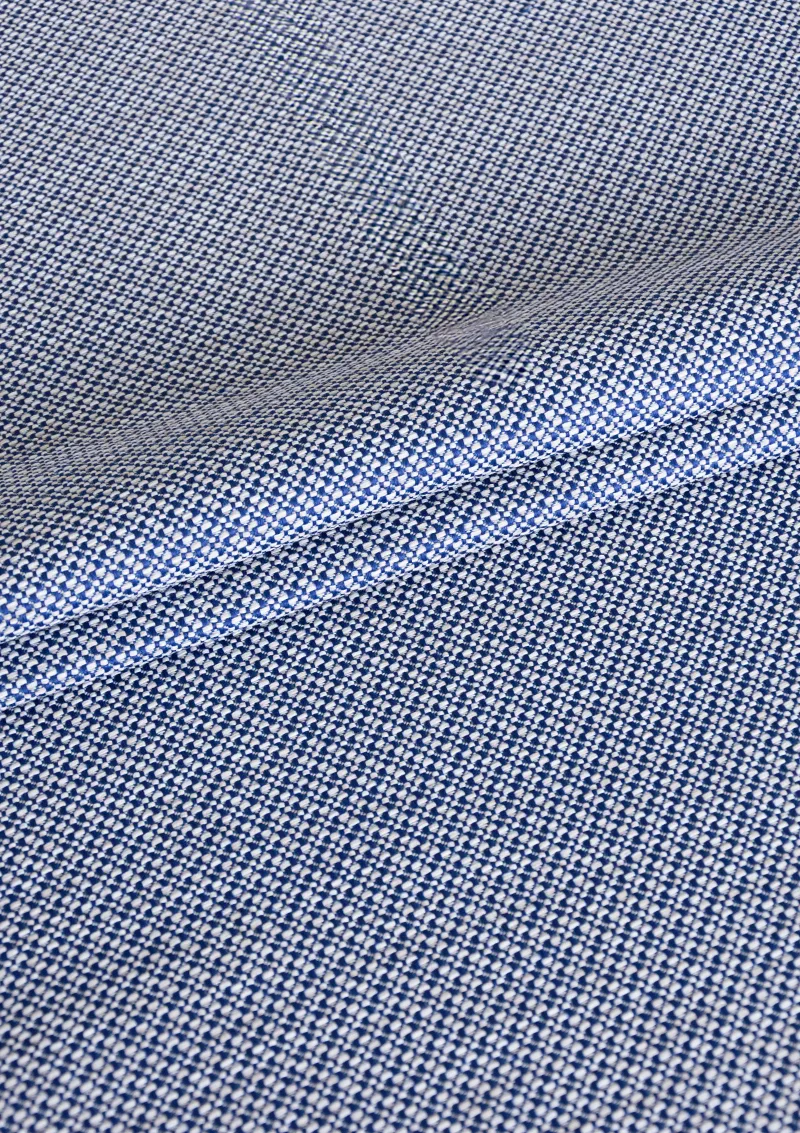 Zoomed-in view of Azuria outdoor fabric highlighting fine texture, color depth, and water-repellent surface. Blue navy color